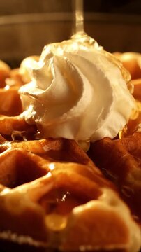 Premium Shot Of Belgian Waffle Grid Pattern With Maple Syrup Pooling In Holes Whipped Cream Dollop And Crispy Edges In Golden Morning Light Sharp Detail Food Commercial
