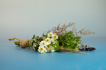 Traditional Assumption Day herb bouquet with wildflowers and wheat