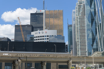 Naklejka premium looking north near Bay St from Harbour St to Scotiabank Arena, Maple Leaf Sports & Entertainment (MLSE), and corporate office towers, Toronto
