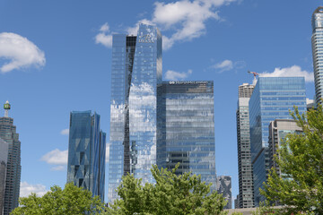 Naklejka premium reflection of a cloudy blue sky on high-rises in the South Core / South Financial District, Toronto