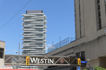 Fototapeta premium The Westin Harbour Castle pedestrian skywalk over Queens Quay W, Toronto (in the distance: Pier 27 The Tower On The Lake, apartment building)