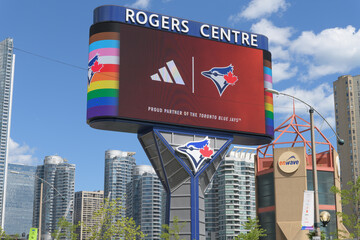 Fototapeta premium Toronto Rogers Centre Gardiner LED Pylon (located at Rees St & Bremner Blvd) with advertisement for Adidas and Blue Jays