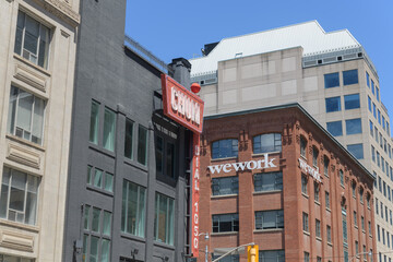 Naklejka premium vintage neon CHUM and contemporary We Works signs on buildings at Richmond St W and Duncan St, Toronto
