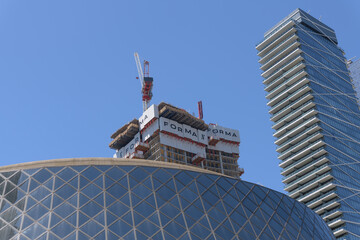 Naklejka premium view of Roy Thomson Hall (bottom), Forma condominium complex under construction, and Theatre Park, an apartment in Toronto