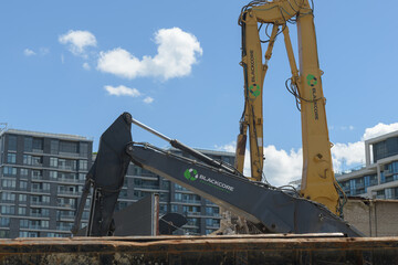 Fototapeta premium construction site with Blackcore Construction Inc machinery at about 259 Lake Shore Blvd E, Toronto