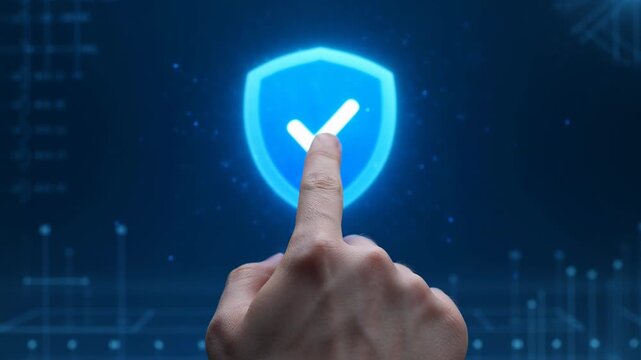 Hand taps glowing shield icon. Digital interface shows secure access. Blue futuristic background with data grid