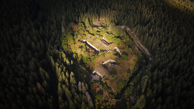 Aerial view of Fort Guyot surrounded by dense coniferous forest in Les Rousses, Bourgogne-Franche-Comte, France.