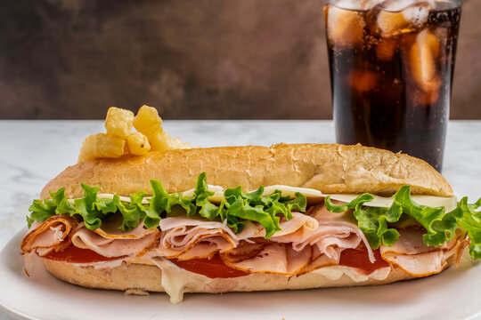 ham cheese  sub  with french fries and  soda