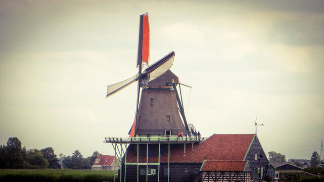 De Kat Windmill. Traditional Dutch old wooden windmill in Zaanse Schans - museum village in Zaandam. The Netherlands.