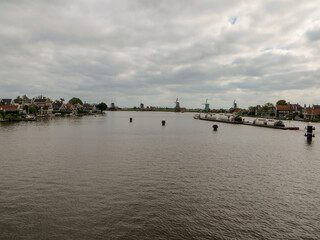 Fototapeta premium Panoramic view of windmills in Zaanse Schans, traditional village in the Netherlands.