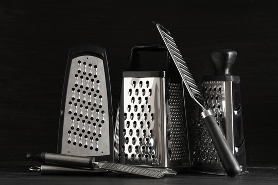 Assortment of stainless steel kitchen graters and zesters for food preparation and culinary tasks, these essential culinary tools are used for various food preparation tasks like grating cheese