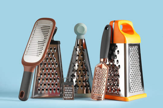 Assortment of stainless steel kitchen graters and zesters for food preparation and culinary tasks, these essential culinary tools are used for various food preparation tasks, including grating