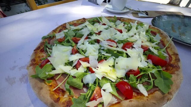 Italian Pizza With Prosciutto Arugula Cherry Tomatoes And Shaved Parmesan Cheese. Mediterranean Food 