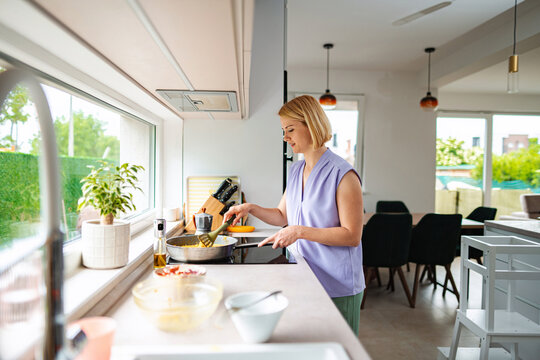 Cooking a delicious meal in a bright modern kitchen
