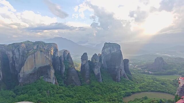 Aerial view of Meteora monasteries and the rock formations in the mountains of Greece near Kalabaka city. Monastery of the Holy Trinity. Unesco world heritage site. Drone Video