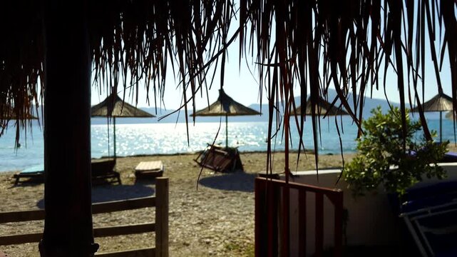 Empty Sea Beach With Straw Umbrellas And Loungers During Calm Summer Siesta Hour. Empty Tropical Marine Coast In Resort