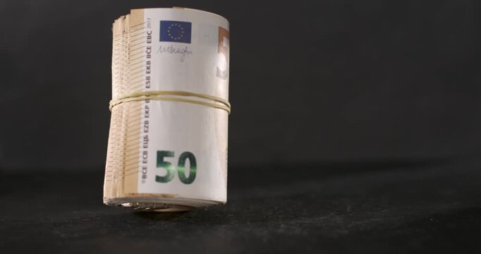 Fifty dollar bill falling in slow motion with detailed movement