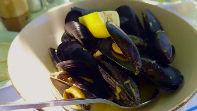Steamed Mussels In Shells Served With Lemon Wedge. Fresh Mediterranean Seafood Dish. Clams Lunch