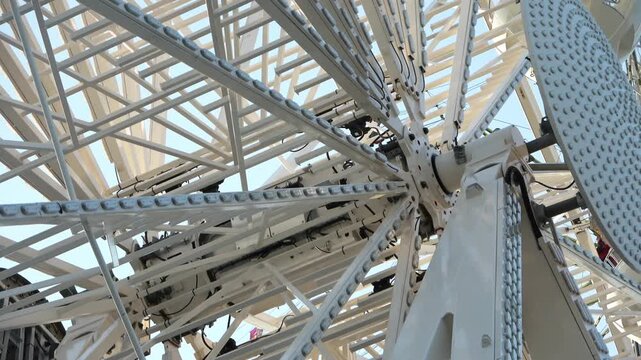 Close up view of a spinning ferris wheel hub