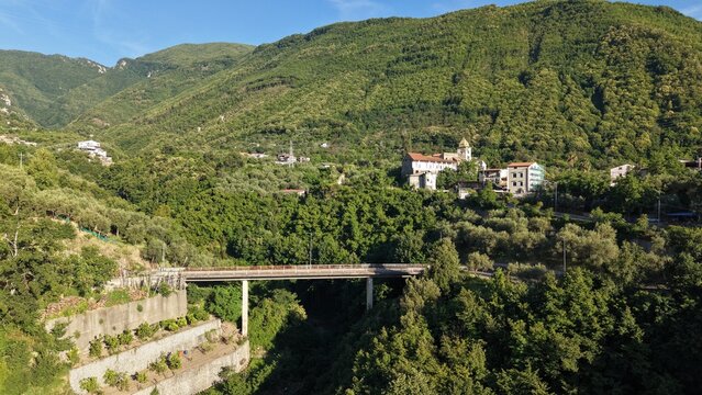 Aerial view of bridge over green valley near Chiesa di Sant'Agnello Abate church, Gragnano, Italy
