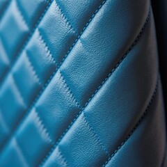 Naklejka premium Close-up view of blue quilted material with stitched diamond pattern. Material has realistic fine grain texture. Soft subtle light reflection adds depth.
