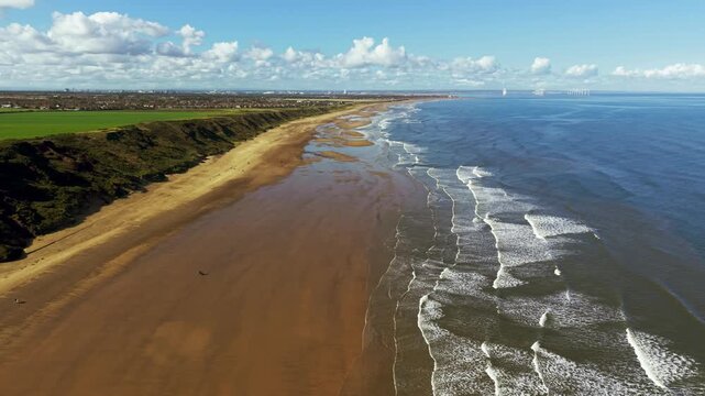 Aerial view from Saltburn towards Marske and Redcar with offshore wind farm