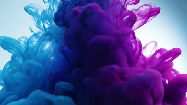 Vibrant blue and purple ink clouds swirling in motion video
