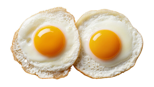 Isolated two perfectly cooked fried eggs with vibrant yellow yolks, ready for breakfast