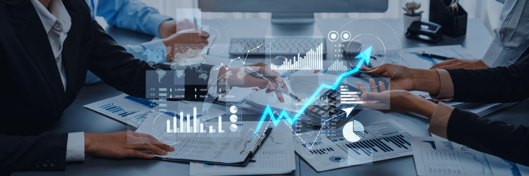 Business team collaborates in a modern office, analyzing financial growth through charts and graphs, showcasing strategic planning and effective teamwork. Scalp