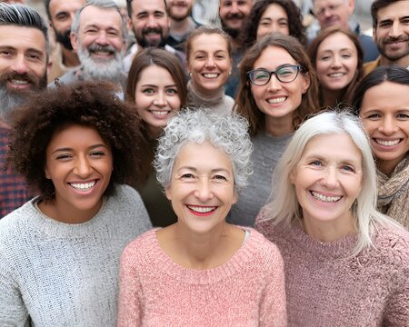 Happy multi-ethnic multi-generational group of diverse smiling people looking at the camera
