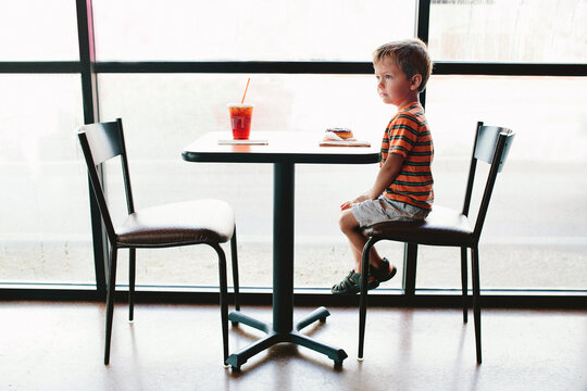boy sitting at table 