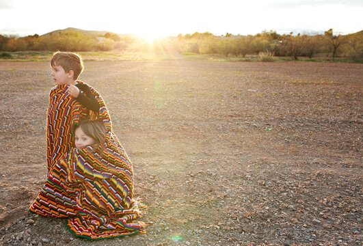 Brother and sister in desert field