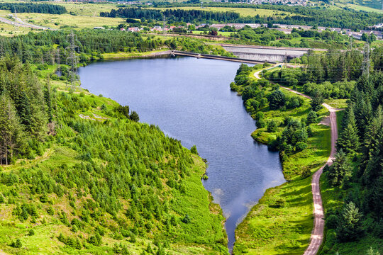 High angle view of Carno Reservoir in Wales surrounded by green hills