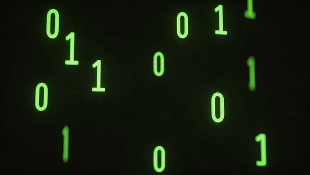 Binary code glowing green on black