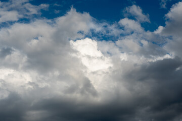 Obraz premium Dramatic Cloudscape With Sunlight Breaking Through Under Blue Sky