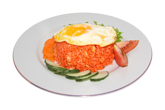 Indonesian red fried rice with sunny side up egg topping, isolated on transparent background