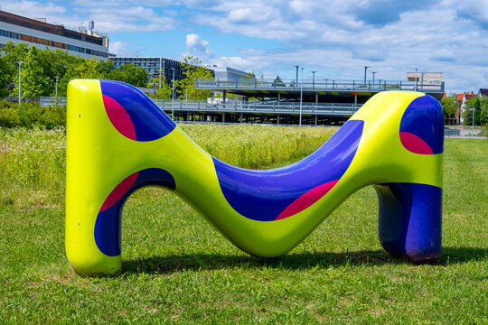 Merck KGaA colorful letter M sculpture, corporate logo pharmaceutical company Modern office headquarters building facade, biotechnology industry Contemporary office architecture, Darmstadt, Germany