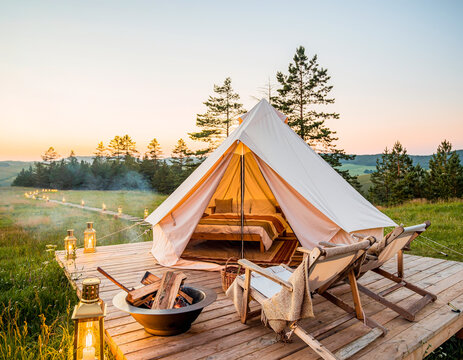 Luxury Glamping Tent at Sunset in Scenic Natural Landscape
