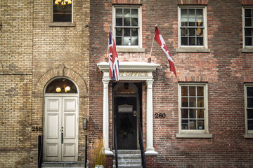 Naklejka premium TORONTO, CANADA - DECEMBER 21, 2016: Toronto First Post Office entrance at 260 Adelaide Street East, showing a historic postal landmark in downtown Canada in winter.