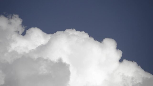 Cloud Timelapse Moving Across Blue Sky