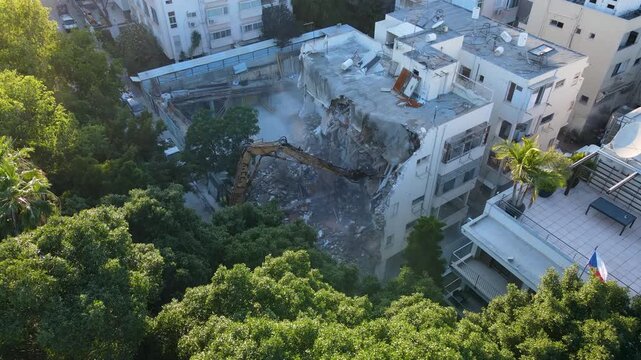 Drone view of active building demolition in Israeli residential neighborhood, urban renewal, פינוי בינוי, תמא38 and real estate development.