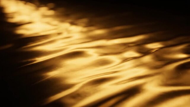 Abstract golden liquid shimmering with dynamic light reflections and ripples