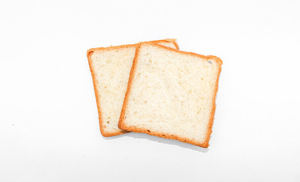 Two slices of toast white sandwich bread isolated on white background, White square sliced ​​bread on a white isolated background. Top view