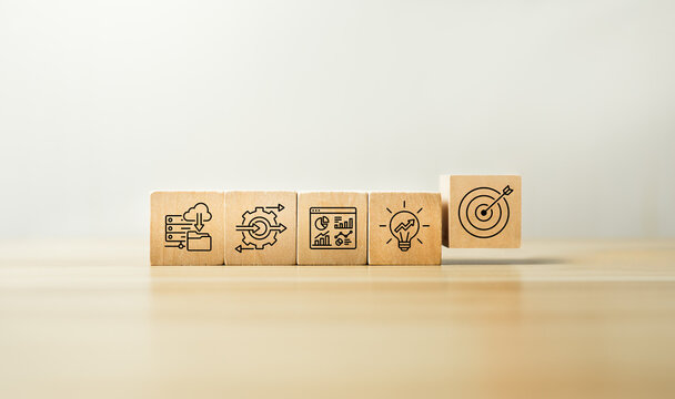 Business automation strategy concept with wooden blocks showing cloud data process optimization analytics dashboard growth idea and target icons for digital transformation