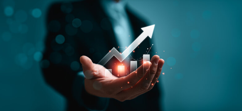 Business growth and performance improvement concept with professional holding rising arrow chart showing financial progress revenue strategy success planning and digital analytics