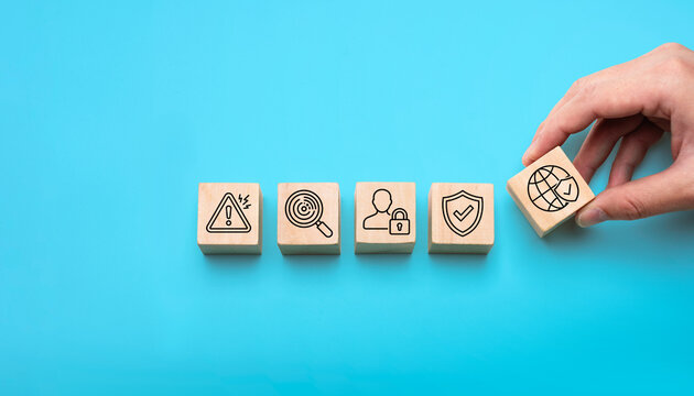 Cybersecurity risk management concept with wooden blocks showing threat warning detection authentication shield protection and global data security framework for business privacy compliance