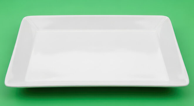 Square White Plate on Green Background