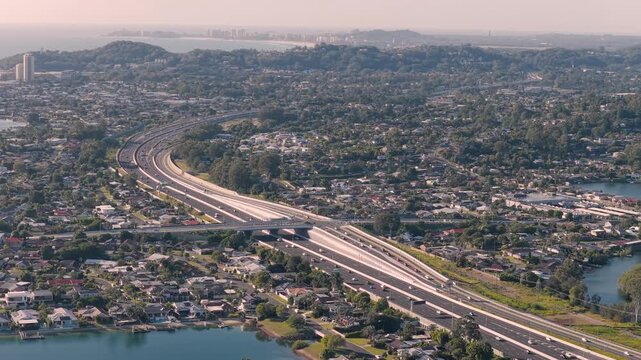Panoramic Aerial View Of The M1 Pacific Motorway Over The Suburbs In The Gold Coast, QLD, Australia.