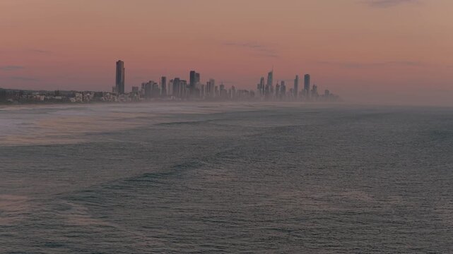 Surfers Paradise Skyline In Queensland, Australia, During A Hazy Sunrise. - aerial shot