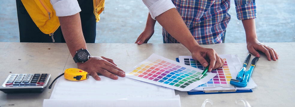 Banner Contractor construction engineer meeting on architect table at construction site. Businessman engineer manager discuss talk together foreman team builder using measure tape with copy space.